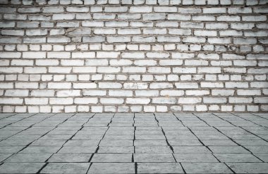 Duvarı tuğlalı ve döşemesi fayanslı boş bir oda. İç arkaplan.