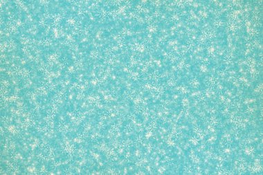 Eski kağıt dokusunda kar taneleri olan eski bir Noel arkaplanı