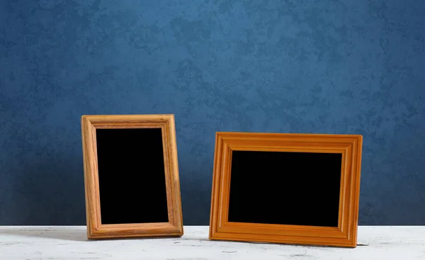 Wooden Photo Frames Table Blue Wall — Stock Photo, Image