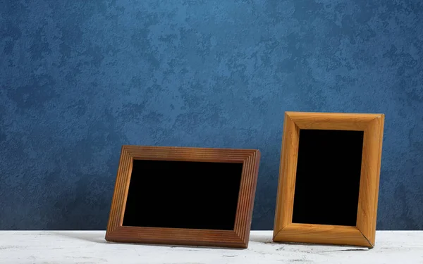 Wooden Photo Frames Table Blue Wall — Stock Photo, Image