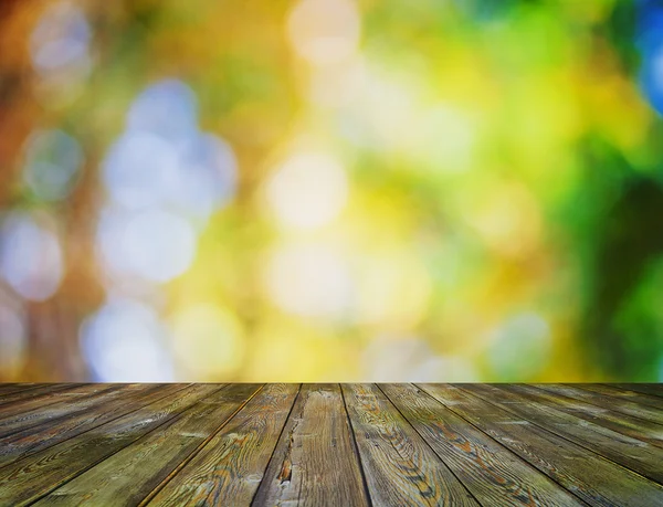 Bokeh lumineux et plancher en bois — Photo