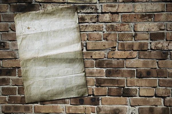 Paper on brickwall — Stock Photo, Image