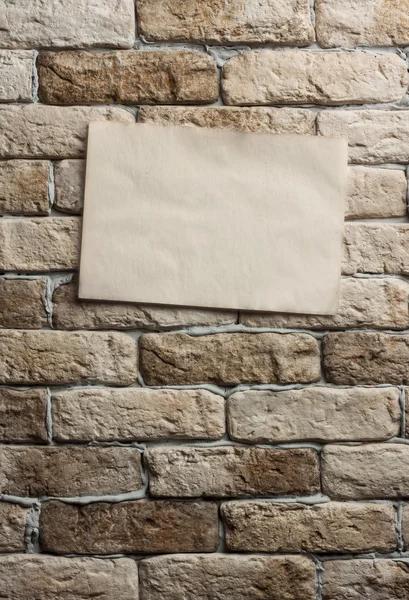 Old paper on wall — Stock Photo, Image