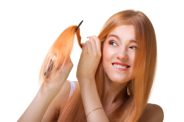 Redhead girl brushing hair — Stock Photo, Image