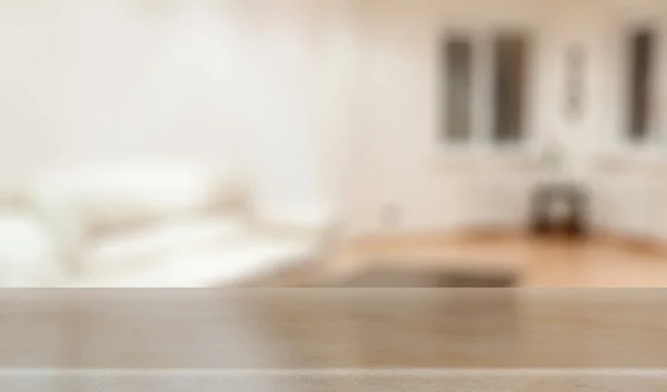 Desk in blurred living room — Stock Photo, Image