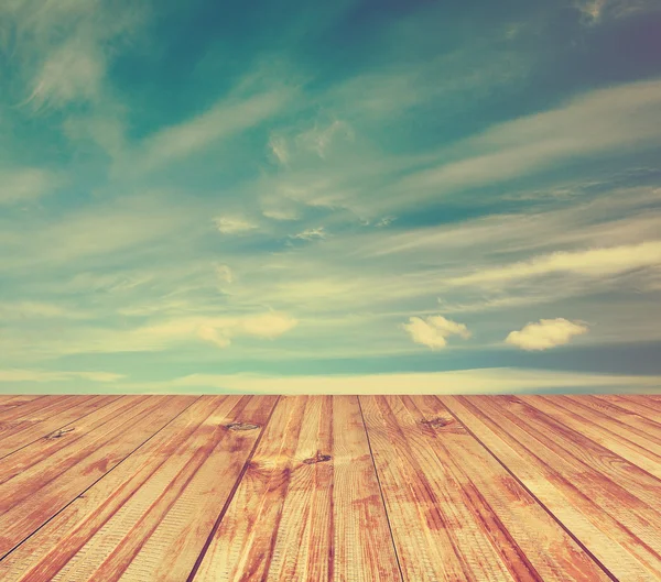 Sunset sky and wood floor Stock Picture