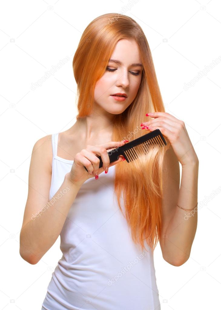 Redhead girl brushing hair