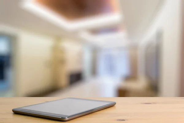 Tablet on wooden table — Stock Photo, Image