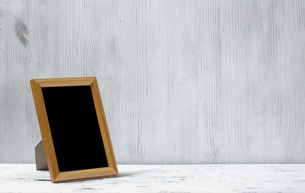 Photo frame on table — Stock Photo, Image