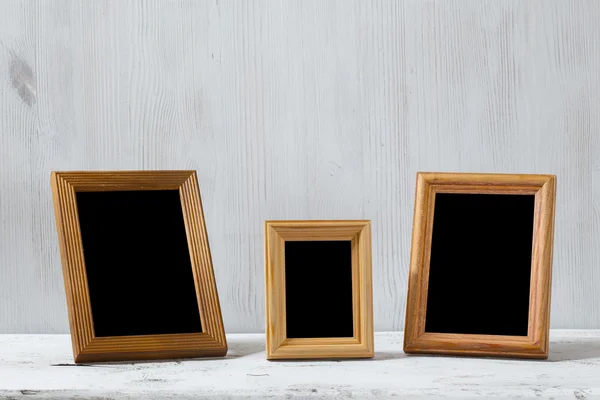 Photo frames on table — Stock Photo, Image