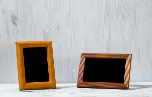 Photo frames on table — Stock Photo, Image