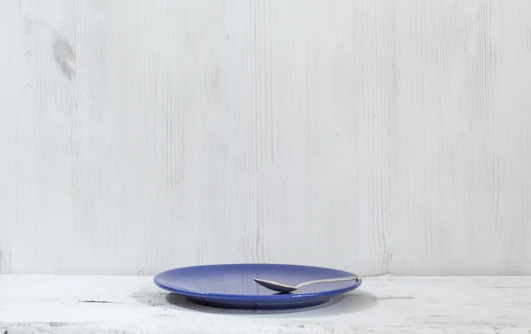 Plate on white table — Stock Photo, Image