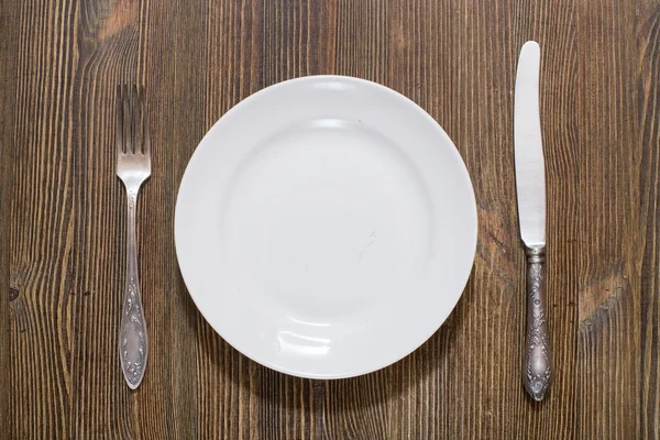 Antique fork, knife and plate — Stock Photo, Image