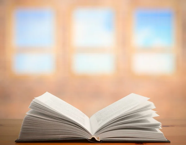Book on table in old room — Stock Photo, Image