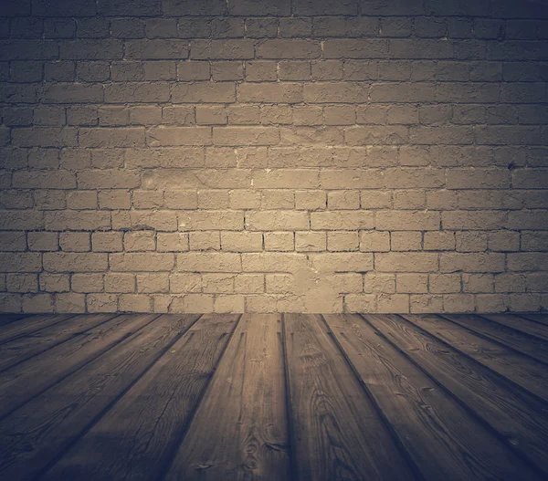 Room with brick wall and wooden floor — Stock Photo, Image