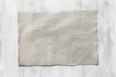 ahşap zemin üzerinde boş kağıt