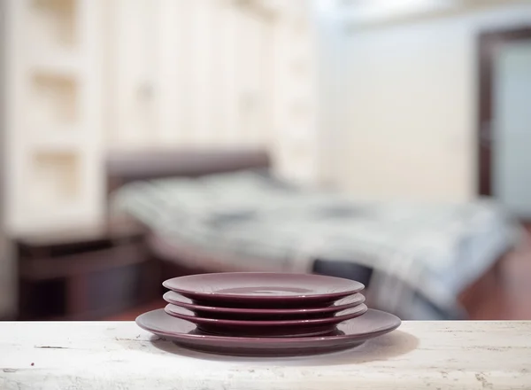 Colorful plates on table — Stock Photo, Image