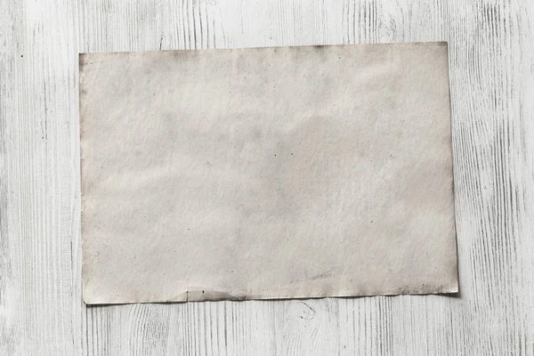 Blank paper on wooden background — Stock Photo, Image