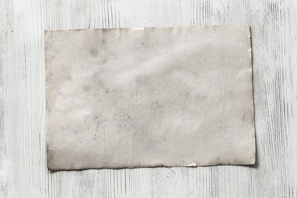 Blank paper on wooden background — Stock Photo, Image