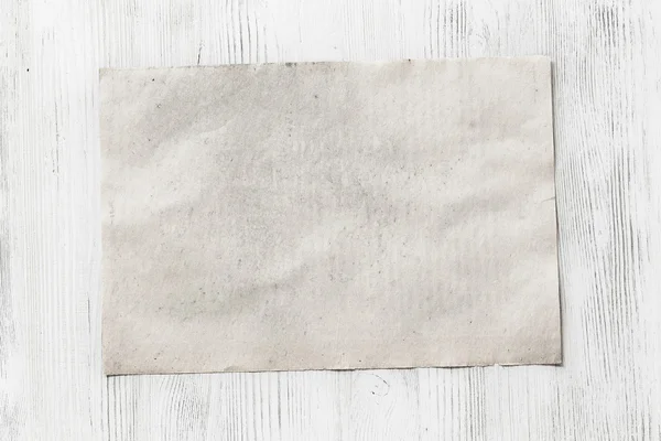Ahşap zemin üzerinde boş kağıt — Stok fotoğraf