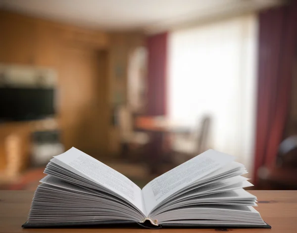 Open book on wooden table — Stock Photo, Image