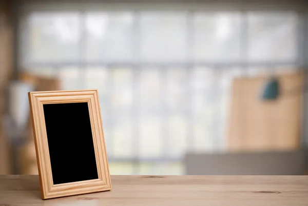 Moldura da foto na mesa de madeira — Fotografia de Stock