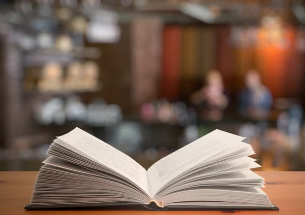 Open book on table — Stock Photo, Image