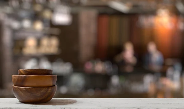 Stack of empty wooden bowls on table — Stock Photo, Image