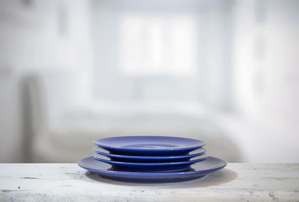 Colorful plates on table — Stock Photo, Image