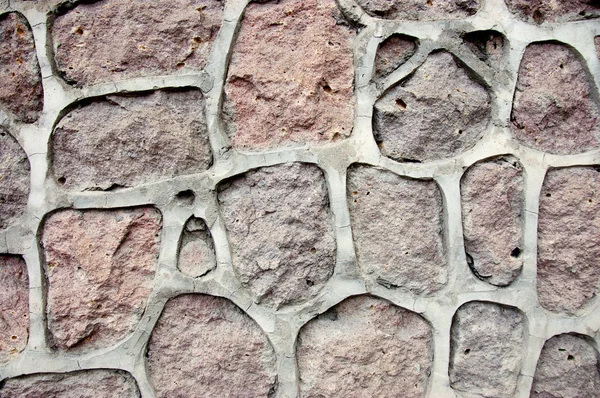Decoration on a wall made of natural stone — Stock Photo, Image