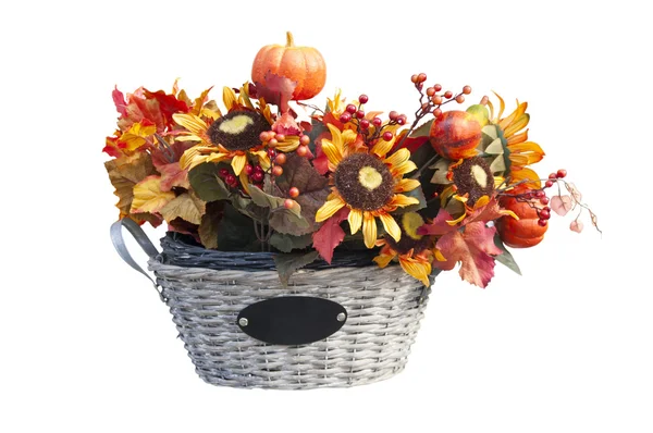 Basket with autumn leaves and flowers — Stock Photo, Image