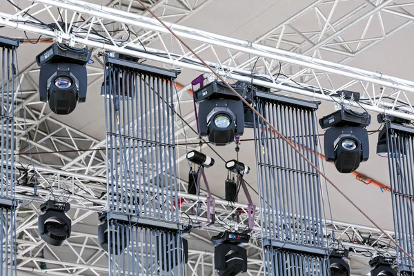 spot lighting under roof of outdoor concert stage