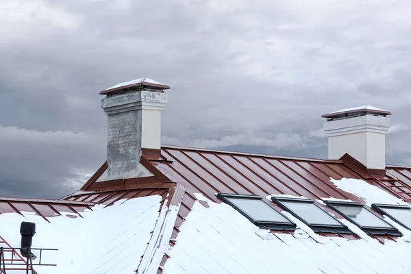 snow roof with chimneys and skylights