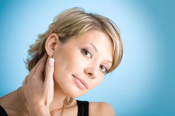 Portrait of attractive girl over blue — Stock Photo, Image