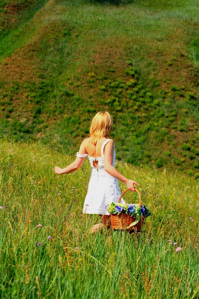 Sexy girl walk away with basket — Stock Photo, Image