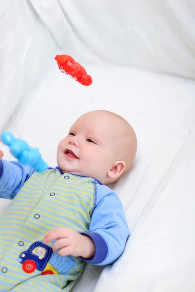 Baby playing with toys — Stock Photo, Image