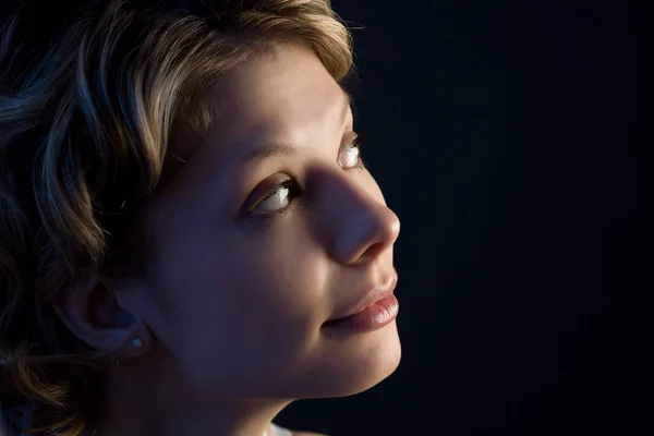 Portrait of pretty blond girl looking up — Stock Photo, Image