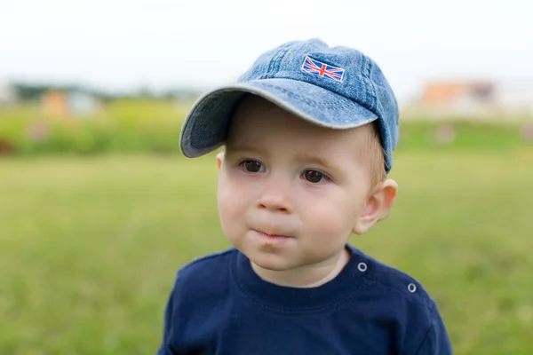 Little boy in hat with interest look forward — Stock Photo, Image