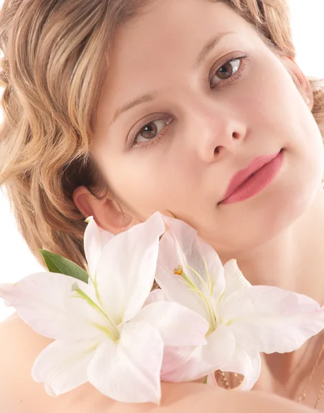 Portrait of attractive blond girl with white lily — Stock Photo, Image