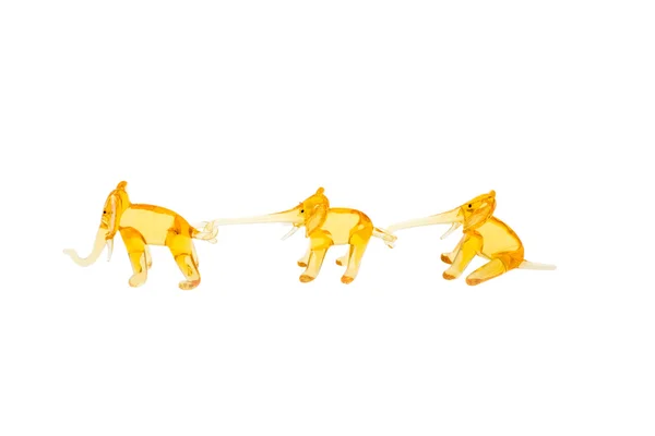 Glass elephants in chain isolated on white — Stock Photo, Image