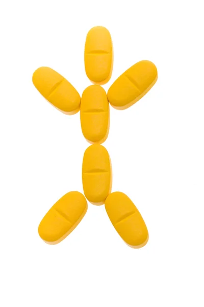 Άνθρωπος σιλουέτα από πορτοκαλί χάπια. Σύμβολο της αποκατάστασης — Φωτογραφία Αρχείου