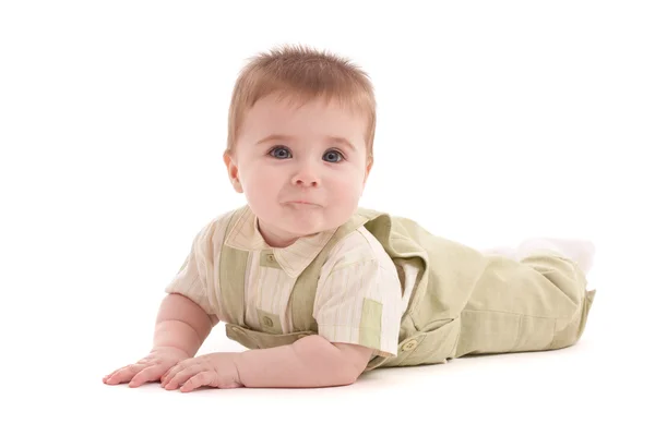 Portrait d'adorable bébé aux yeux bleus couché — Photo