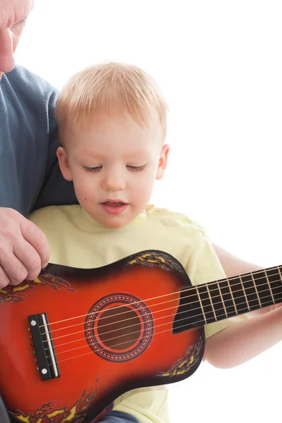 Grandfather teaching grandson play on acoustic guitar — Stock Photo, Image