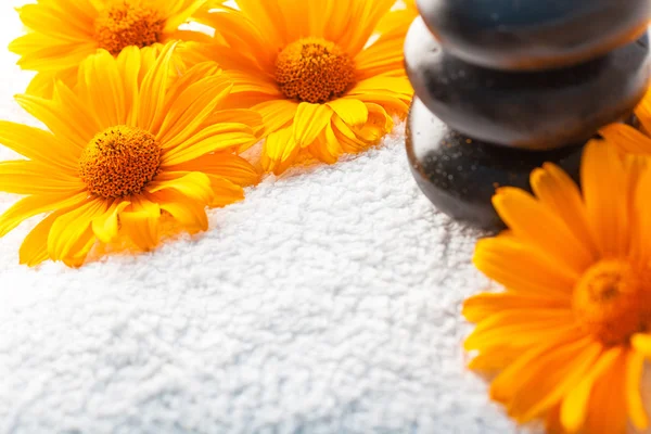 Spa stones on white towel — Stock Photo, Image