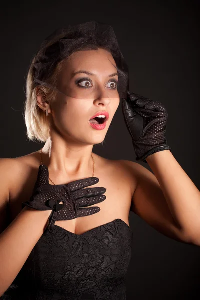 Portrait of amazed retro-style woman in black dress, veill — Stock Photo, Image