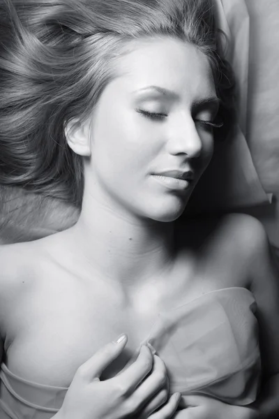 BW portrait of dreaming girl covering your body in blue silk — Stock Photo, Image