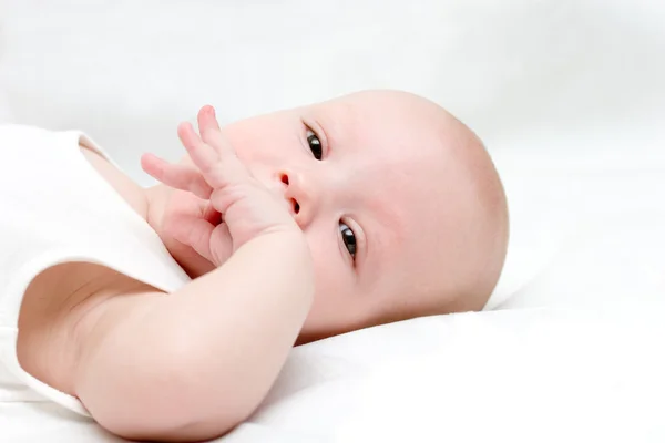 Baby draw your fist into the mouth — Stock Photo, Image