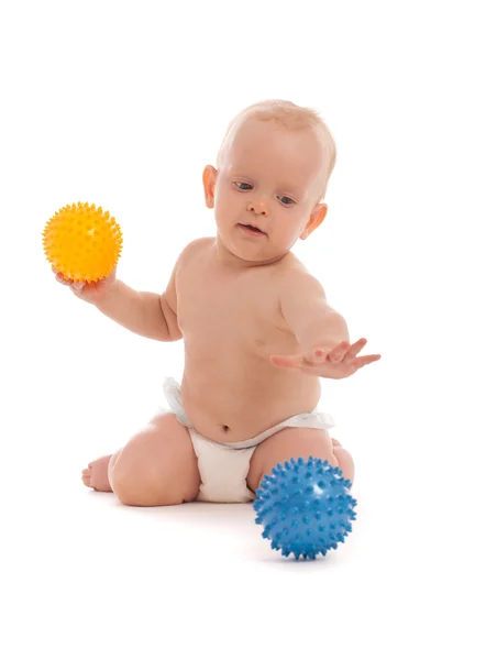 Portrait of little boy playing with two massage balls — Stock Photo, Image