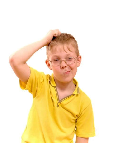 Boy scratches his head in puzzlement or confusion — Stock Photo, Image