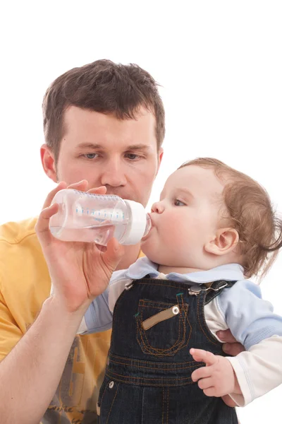 Father give drink to his son — Stock Photo, Image